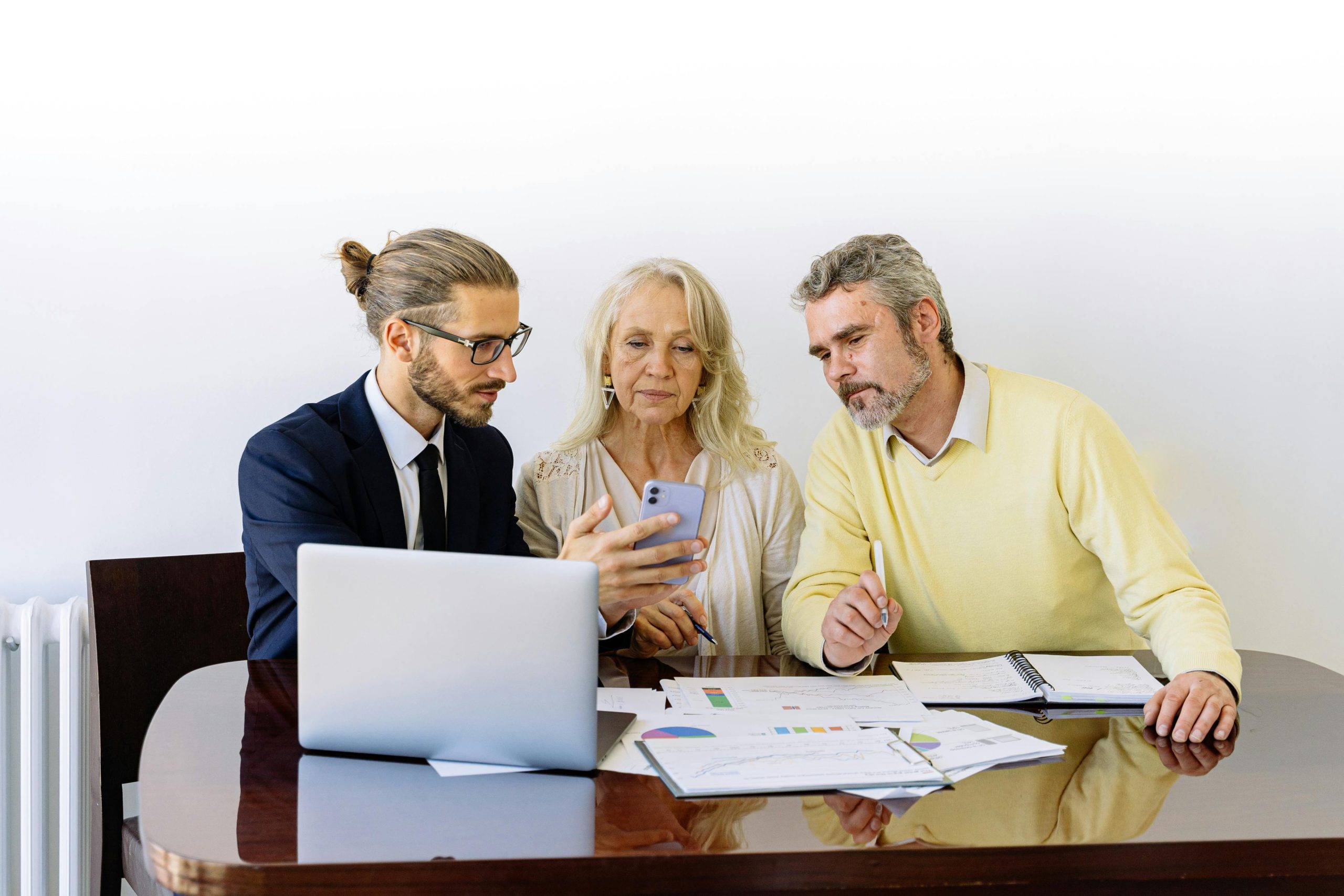 Lender explaining reverse mortgages to a senior couple.